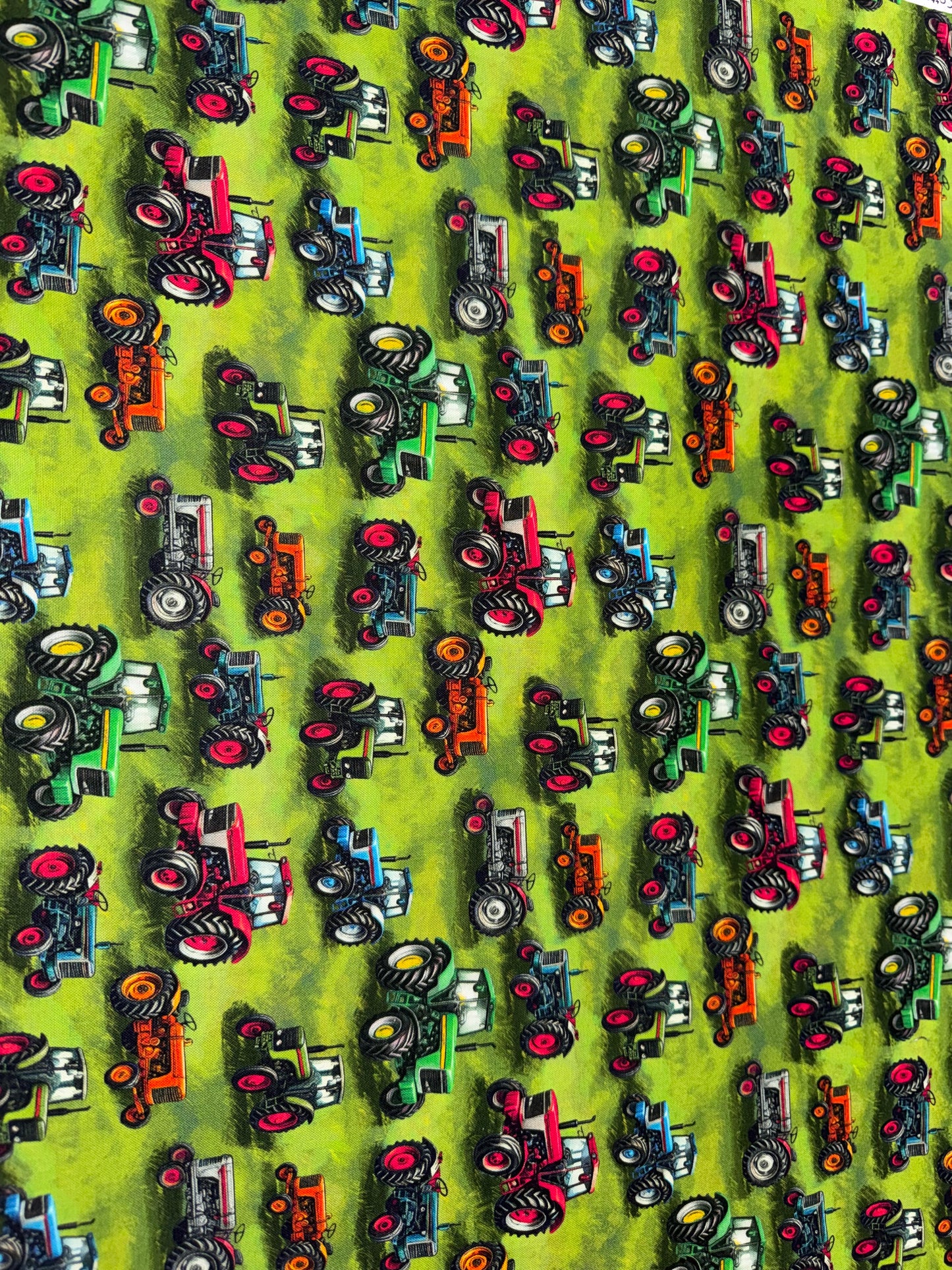 Tractors on a Green Field Background