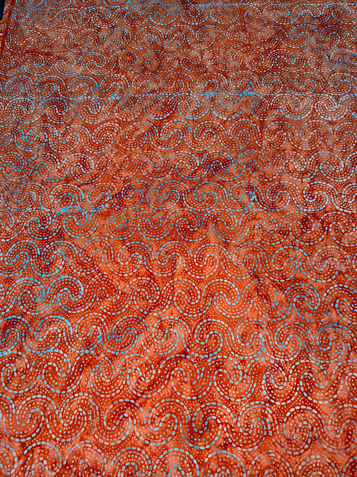 Batik Wideback in Orange Swirls pattern. 13.7m available. BA1057