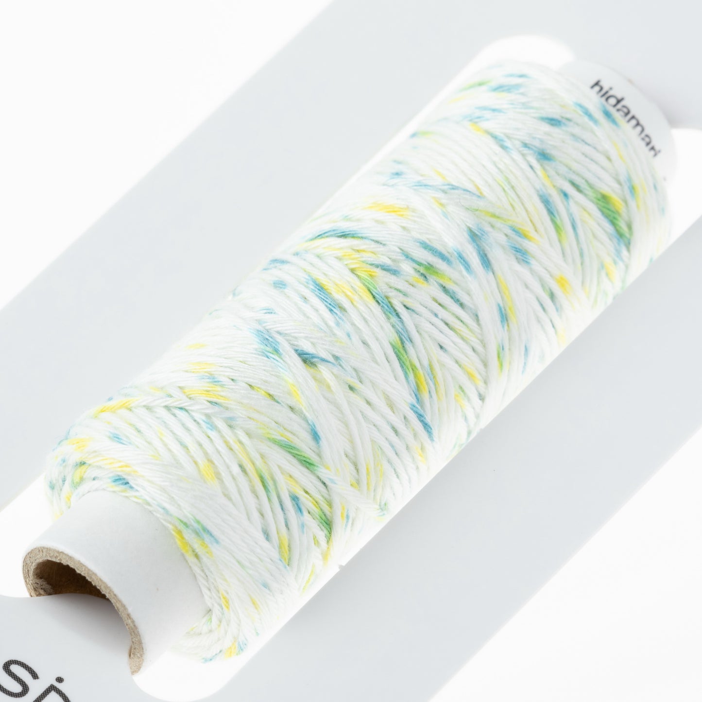 Cosmo Sashiko Thread 302.104 White with Mottled Yellow and Blue