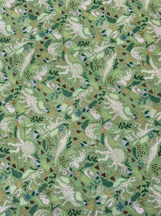 Prehistoric Dinosaurs - Skeletons and Foliage on a Green Background