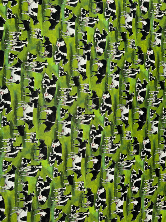 Cows on a Green Field Background