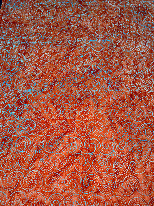 Batik Wideback in Orange Swirls pattern. 13.7m available.   BA1057